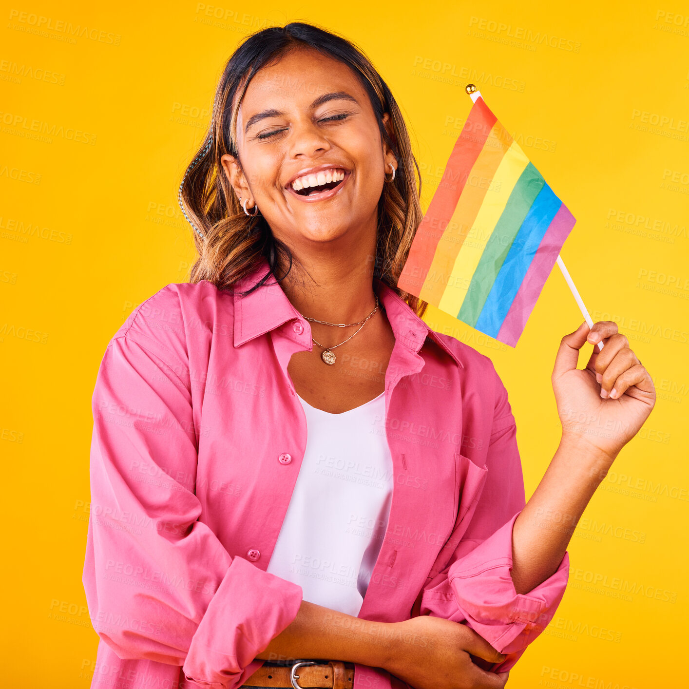 Buy stock photo Happy woman, pride and flag with rainbow and LGBTQ community in studio, equality and celebration on yellow background. Freedom to love, support with lesbian or ally, gen z student with gay identity