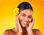 Makeup, flower and portrait of woman in studio with beauty, glow and cosmetic face routine. Skincare, rose and young female model from Mexico with facial treatment isolated by yellow background.
