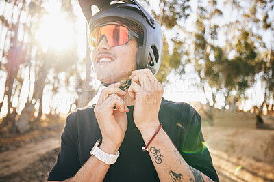 Buy stock photo Cycling, fitness and man with helmet check, in forest with safety for extreme sports in nature. Mountain bike, face and guy cyclist gear tie in park for off road hobby, freedom or adrenaline workout 