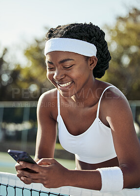 Buy stock photo Tennis, black woman smile and phone text outdoor for sport, fitness and workout with social media at net. Exercise, match training and mobile networking with website and app on court for wellness