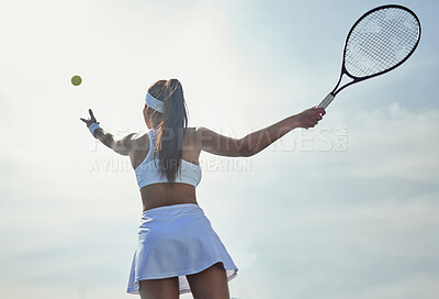 Buy stock photo Woman, tennis and serving with fitness on court and start game, sports and athlete, performance and competition. Health, energy and professional player on outdoor turf, back low angle and racket