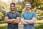 Men, arms crossed and together in portrait, fitness and health and ready for workout, training or summer. Partnership, personal trainer and outdoor sunshine for exercise, smile and wellness in nature