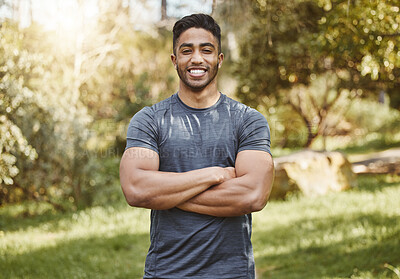 Buy stock photo Happy, fitness and portrait of man with arms crossed in a park for workout, running or wellness. Exercise, face and Indian male runner smile in a forest for training, cardio and positive mindset
