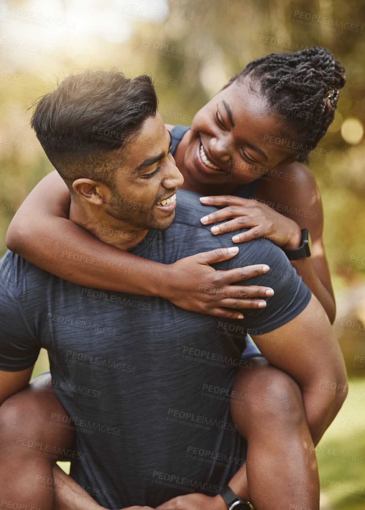 Buy stock photo Fitness, nature and couple piggy back outdoors for exercise, training and running for cardio workout. Dating, happy and interracial man carrying woman for wellness, healthy body and sports in park