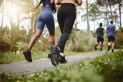 Buy stock photo Back, legs and running with fitness friends in a park together for cardio training, health or wellness. Exercise, sports and workout with athlete people outdoor on a summer morning for a marathon run