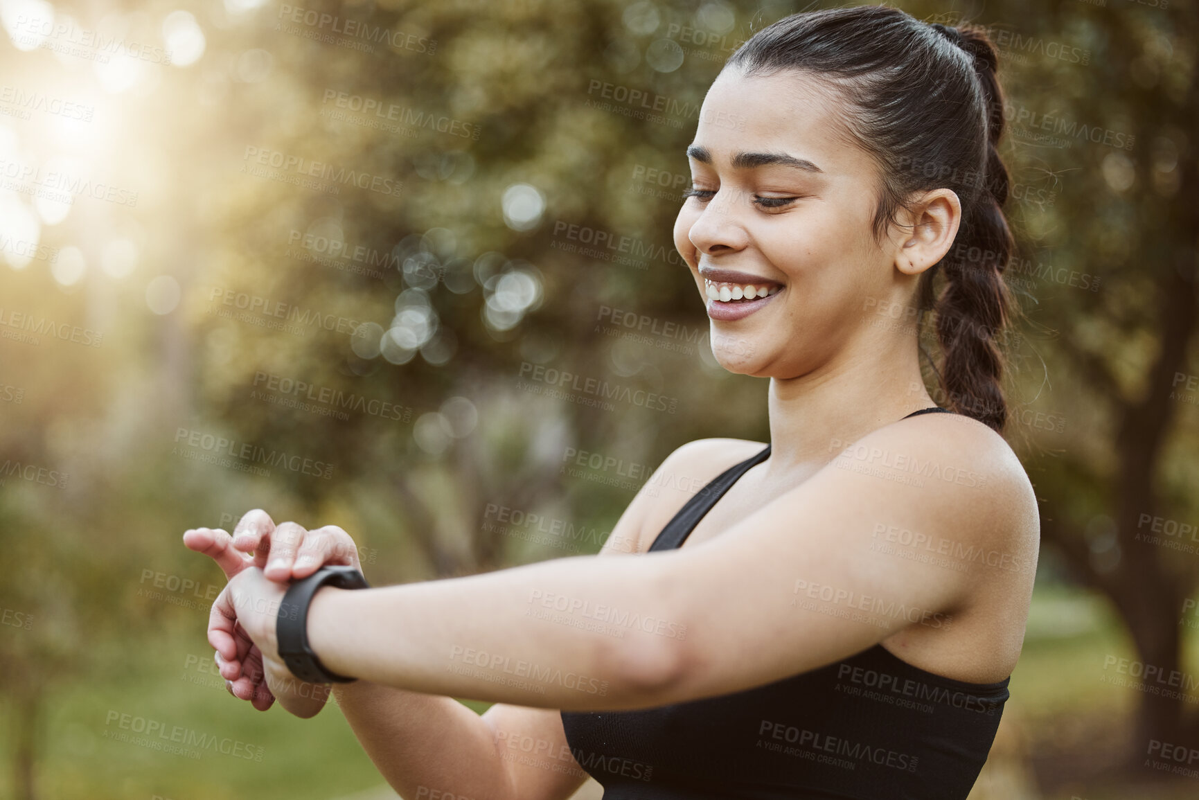 Buy stock photo Happy runner woman, smart watch and park for check, smile or reading for time, results or fitness in nature. Girl, iot clock and monitor for speed, heart rate or smile for exercise, workout or health