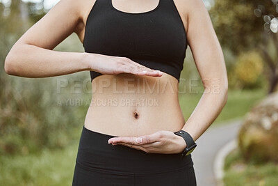 Buy stock photo Woman, hands and stomach in nature for lose weight, tai chi or spiritual wellness in outdoor exercise. Closeup of female person and abdomen for reiki, aura or balance in body care, fitness or park