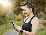 Woman, smile and phone on run, nature and digital by message, notification. Happy person, trail and exercise for fitness, sportswear and sweat in outdoors, workout and health by cardio, break and fit
