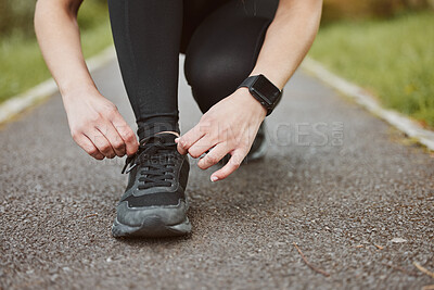 Buy stock photo Person, hands and tying shoes in fitness getting ready running exercise or outdoor cardio workout. Closeup of athlete or runner tie shoe on asphalt in preparation for training or run at the park