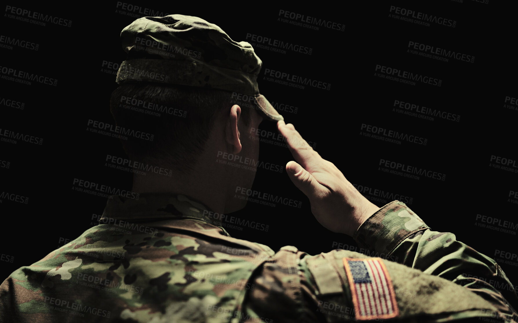 Buy stock photo Back, salute and army with a soldier in uniform on a dark background in studio for service or duty as a patriot. Military, respect and america marine or war veteran from behind, ready for battle