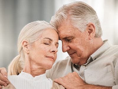 Buy stock photo Old couple, hug and forehead touch, relax on sofa with love and support, bonding while at home with trust and comfort. People together in marriage, partner and retirement with calm and peace of mind