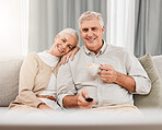 Old couple, happy on couch with coffee and watching tv, time together in retirement, bonding and love at home. People relax with online streaming, subscription and remote control with tea and a show