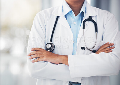 Person, hands and professional doctor with arms crossed or stethoscope for cardiology or healthcare at hospital. Closeup of confident medical nurse or surgeon expert for health advice or emergency