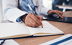 Tablet, hands and doctor writing in book on table, research and planning in hospital. Technology, notebook and medical professional closeup at desk for information, healthcare journal and telehealth