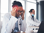 Woman, doctor and headache at desk or healthcare burnout at hospital, mental stress or tired. Black professional female, fatigue and pain at laptop or working brain fog depression, vertigo or sick