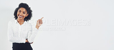 Buy stock photo Pointing, banner and portrait of businesswoman in studio with mockup space for marketing or advertising. Happy, smile and professional female person with show gesture for mock up by white background.