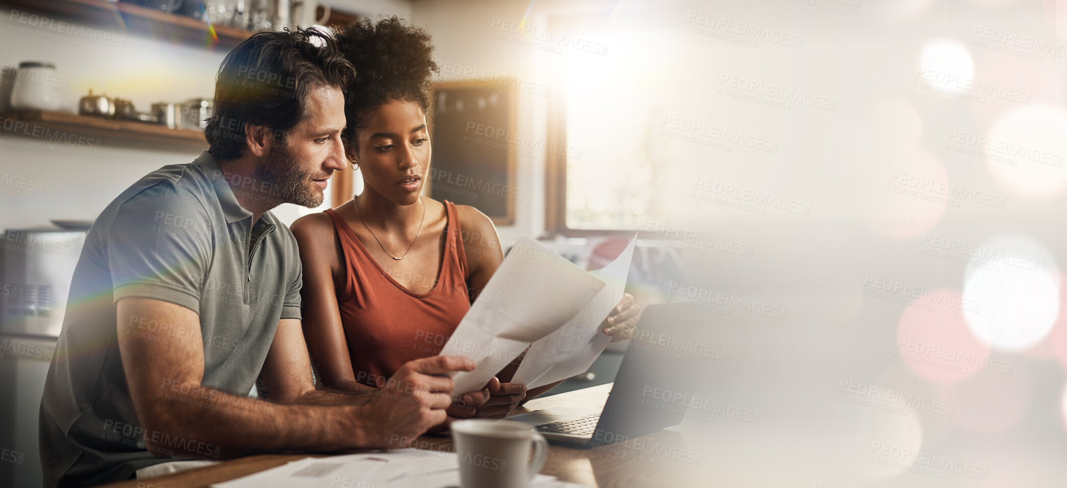 Buy stock photo Laptop, space and an interracial couple in their home for budget planning or finance investment accounting. Documents, mockup or banner with a man and woman reading bank information for savings