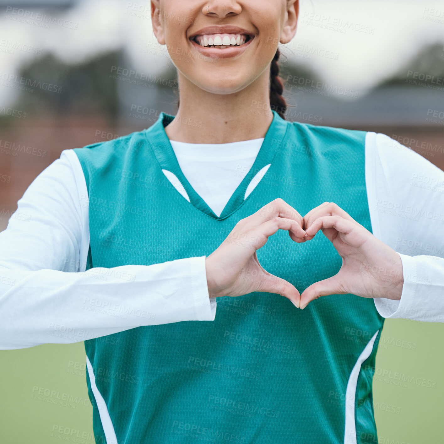 Buy stock photo Sports, heart hands or happy athlete on field for fitness, exercise or workout for cardiovascular health. Love sign, hand gesture or healthy woman in a training game for wellness or hockey practice