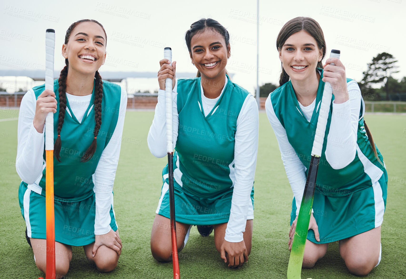 Buy stock photo Portrait, smile and hockey with a woman team outdoor on a field for sports, a game or competition together. Fitness, exercise and diversity with a happy young athlete group on an astro turf court