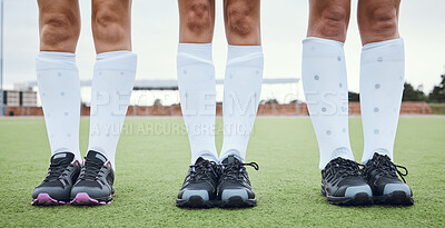 Buy stock photo Legs, shoes and woman hockey team outdoor on a field for a game or competition together in summer. Fitness, training or sports with people on a pitch of a grass for exercise or teamwork on match day