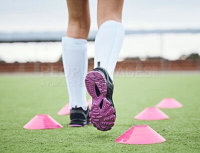 Buy stock photo Cone, legs or athlete running in sports training, workout and warm up exercise on a outdoor hockey turf. Footwear closeup, back or fast person on grass pitch playing in a game for fitness speed