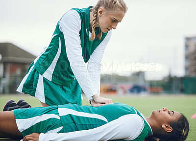 Buy stock photo First aid, cpr and accident with a hockey player on a field to save a player on her team during an emergency. Fitness, sports and heart attack with a woman helping her friend on a field of grass