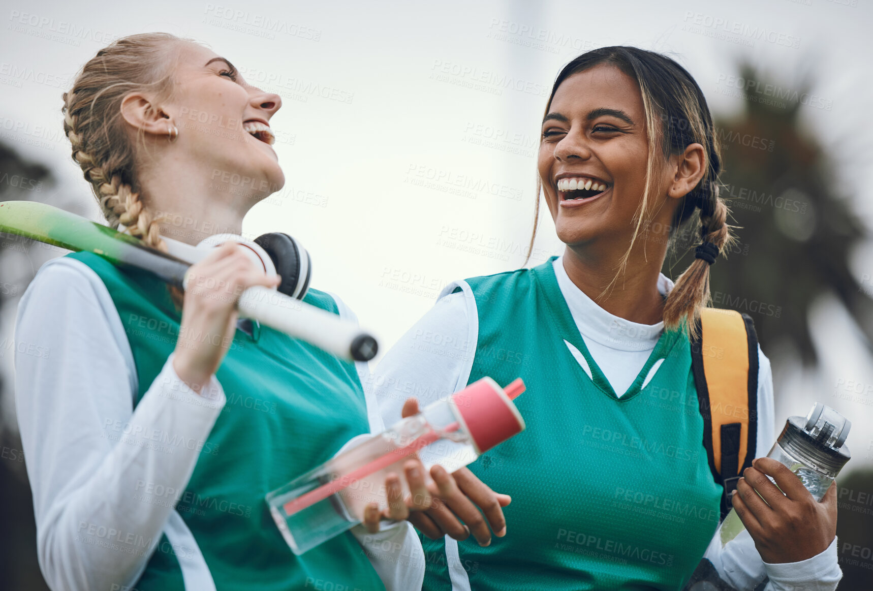 Buy stock photo Funny, team sports or women in conversation on turf or court for break after fitness training or exercise. Smile, happy friends or female hockey players walking, laughing or talking to relax together