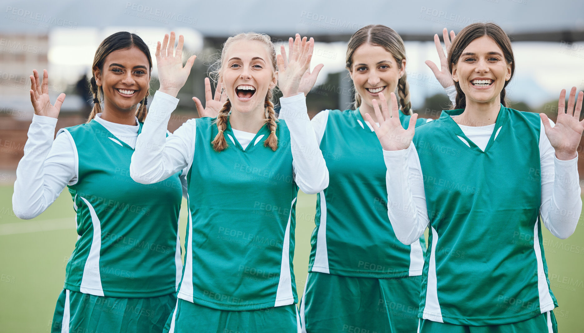 Buy stock photo Sports, women and team with hands for hello or wave with happiness on field outdoor for teamwork, training or workout. Football, group and girls with diversity and hi in nature for game or exercise