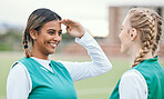 Woman, friends and hockey field for sport or game in competition for training, fitness or smile. Female athlete, exercise clothes and outdoor contest in sun for workout, strong or cardio on grass