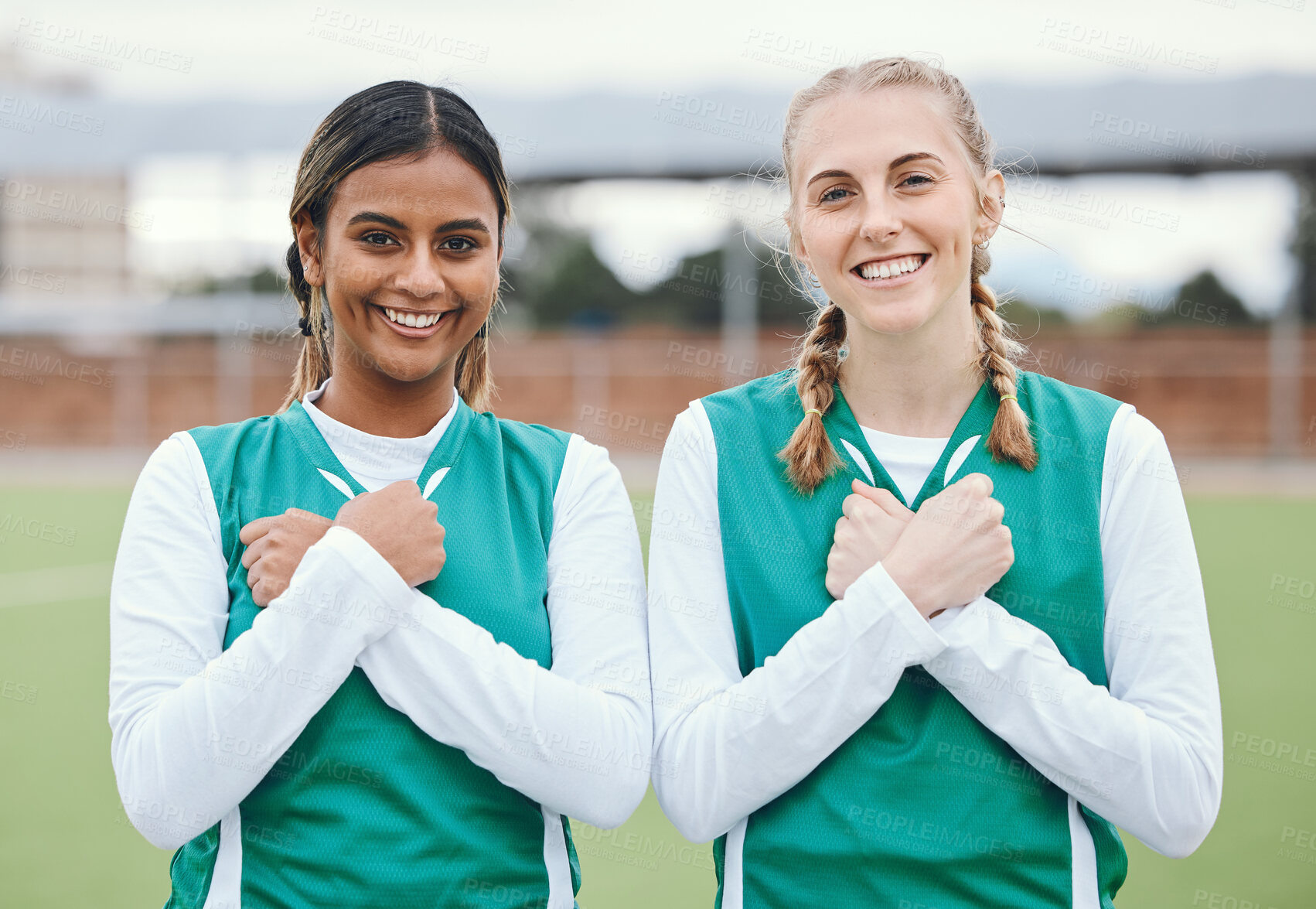 Buy stock photo Crossed arms, sports and portrait of friends for hockey on field for training, exercise and workout. Fitness, team and happy women with hand gesture on chest for teamwork, support and bonding in club