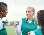 Sports, hockey team and women planning strategy outdoor at field together for competition training. Fitness, group of girls and discussion for game, collaboration for workout and exercise at park