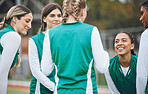 Sports, hockey team and women talking outdoor at field together for competition training. Fitness, happy group of girls and collaboration for workout, exercise for healthy body and planning strategy