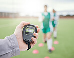 Hands, coach or team with stop watch on field to monitor time, fitness training or exercise progress. Hockey, performance blur or fast sports athlete with timer to check running workout or wellness