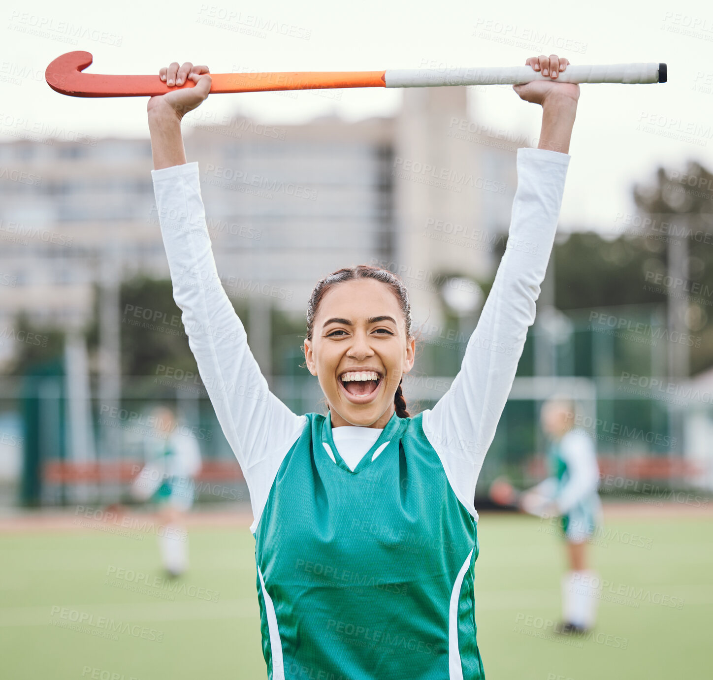 Buy stock photo Hockey player in portrait, woman on turf with celebration and smile for fitness and sports win during game. Cheers, happiness and young athlete with stick, success and champion in competition