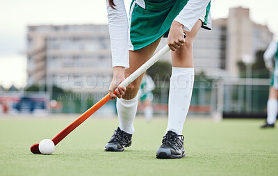 Buy stock photo Fitness, legs and hockey stick with a sports person on a court or field during a game for competition. Exercise, grass and ball with a player training at practice on astro turf for health or wellness