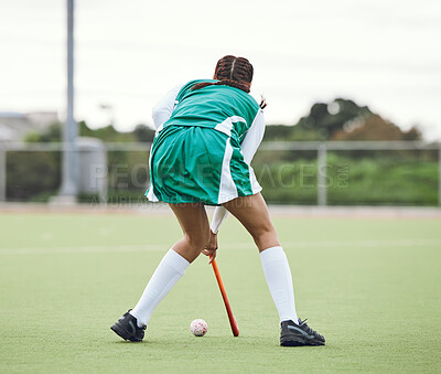 Buy stock photo Hockey, athlete and woman running in game, tournament or competition with ball and stick on grass. Sports, back of player and action play in training, exercise or workout with gear on field ground