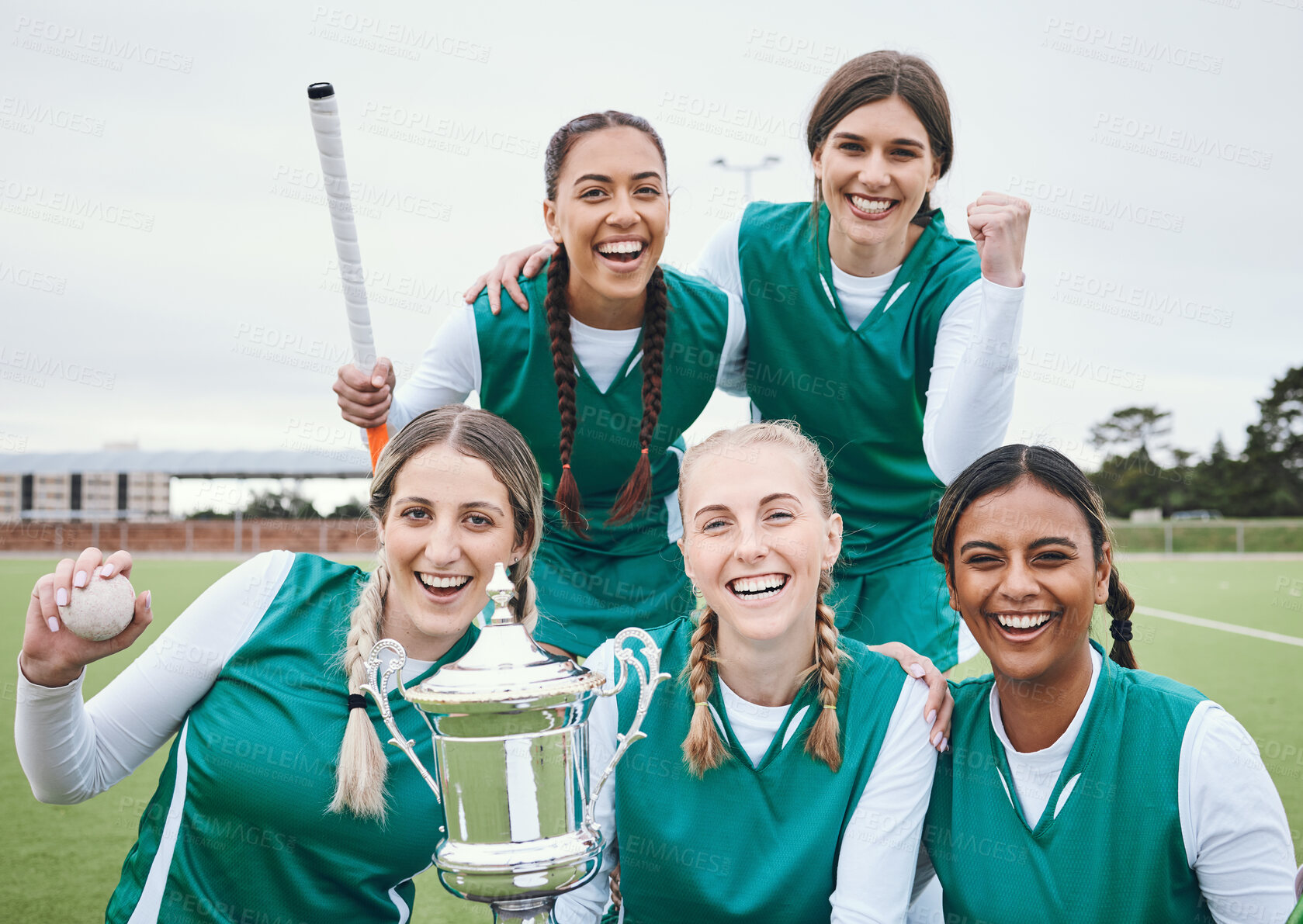 Buy stock photo Women, hockey team and winning trophy in portrait, celebration and success in competition on field. Champion girl group, friends and diversity for sports, goal or happy outdoor at stadium for contest