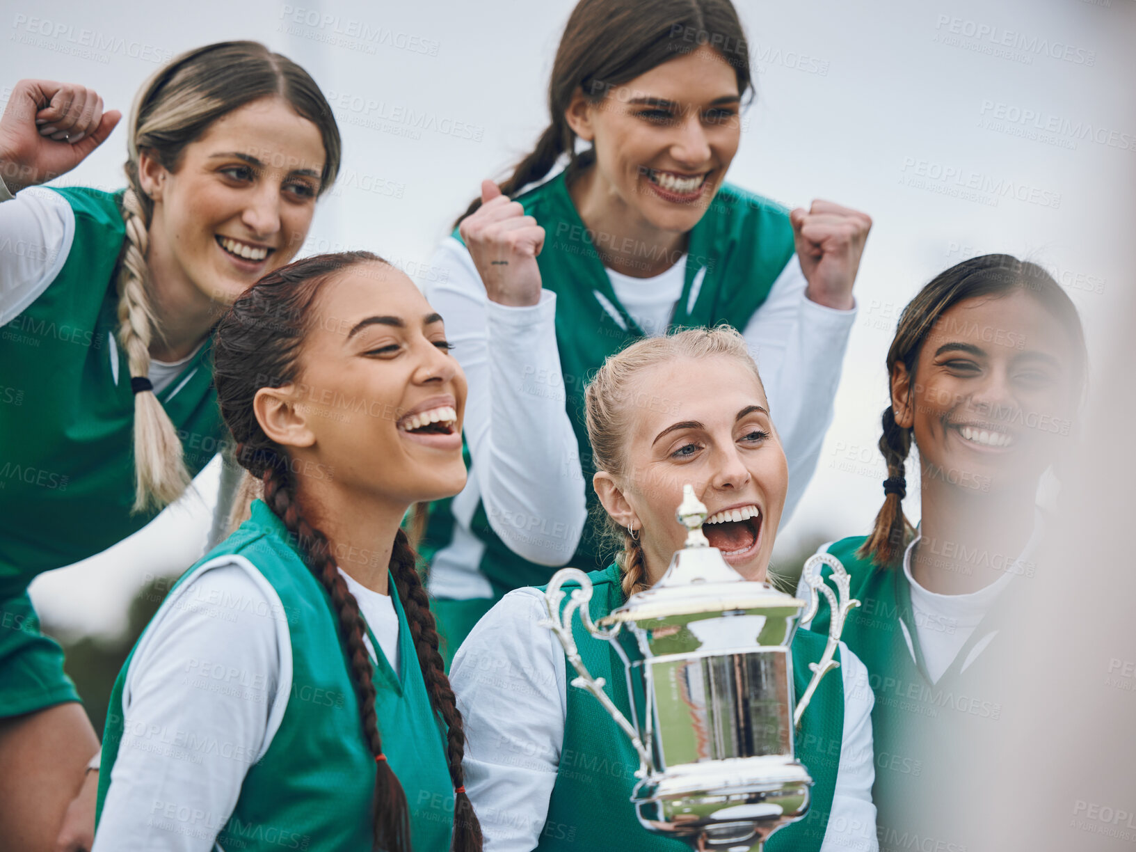 Buy stock photo Sports women, team and trophy in celebration, winning and fist in air for competition on field. Champion girl group, friends and diversity for hockey, goals and happy outdoor at arena for contest