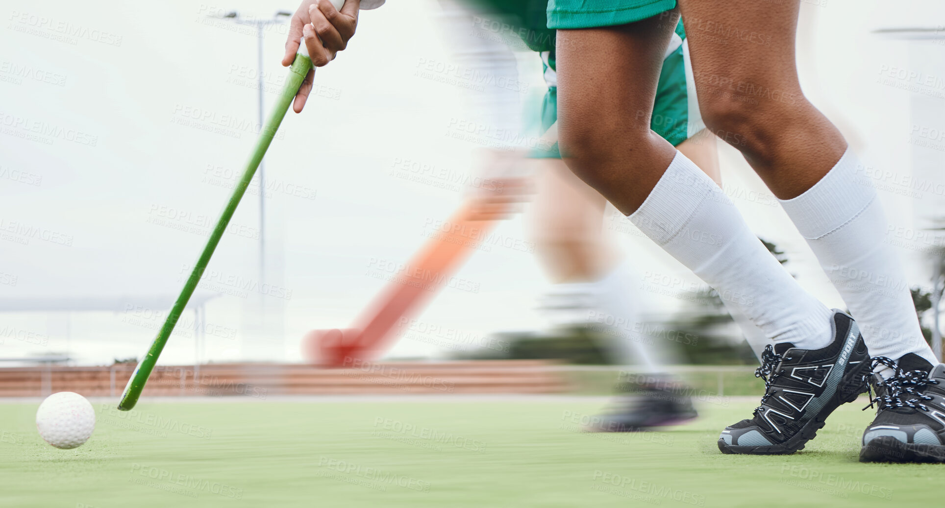 Buy stock photo Person, feet and hockey stick on field, ball with speed or motion for sports goal, training or professional game. Action, legs and turf with performance for outdoor competition, fitness and exercise 