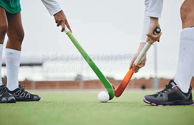 Buy stock photo Fitness, hockey and women with sticks and ball on field for training, competition or challenge outdoor. Sports, person and legs on grass with workout, battle or exercise for wellness in nature 