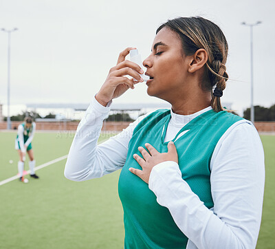 Buy stock photo Asma, hockey woman and medical tool for breathing and healthcare outdoor on sport field. Female student, fitness and exercise in a game with training and workout with breathe for wellness and stress