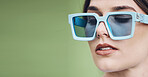 Woman, banner and mockup with fashion sunglasses, green studio background and confidence in cosmetics, posing and vision. Makeup, beauty and editorial for street style, trendy and cool aesthetic 