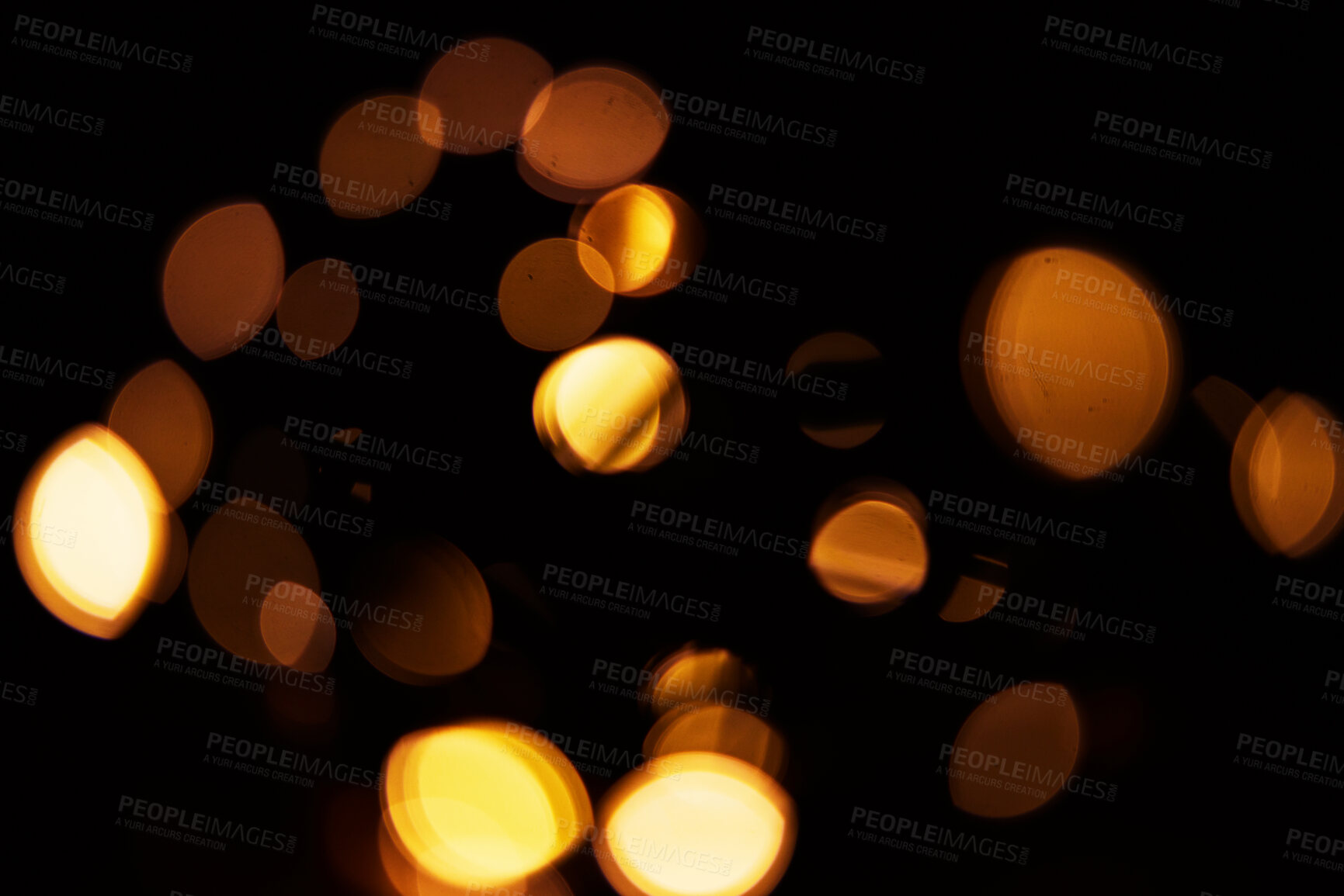 Buy stock photo Gold, bokeh and light in a studio with a dark background for celebration, event or party. Mockup, sparkle and yellow for glow, magic or shine for festive decoration by a black backdrop with mock up.