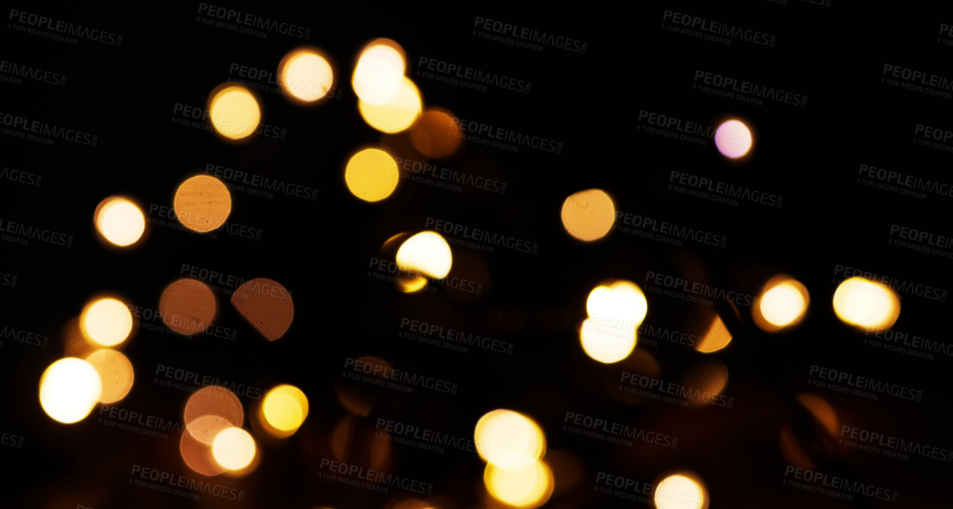 Buy stock photo Yellow, bokeh and light in a studio with a dark background for celebration, event or party. Mockup, sparkle and gold for glow, magic or shine for festive decoration by a black backdrop with mock up.