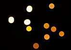 Gold, bokeh and mockup with lights on dark background for New Year, Christmas or festive fireworks celebration at night. Mock up, space and sparkle with magic glow or shine on black backdrop