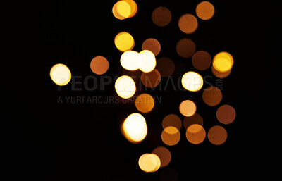 Buy stock photo Gold, confetti and lights in a studio with dark background for celebration, event or party. Mockup, sparkle and yellow for glow, magic or shine for festive decoration by black backdrop with mock up.