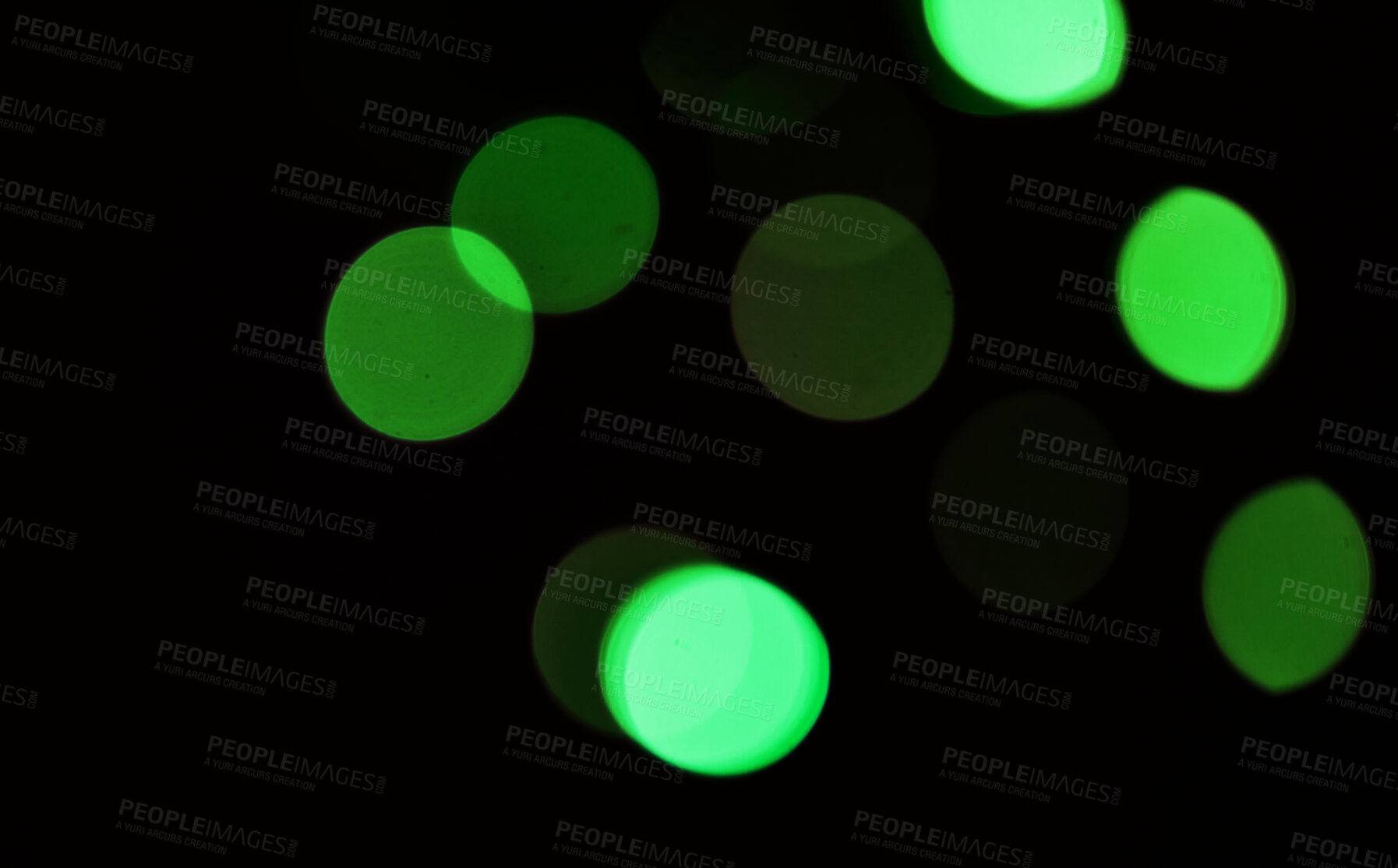 Buy stock photo Green, bokeh and light in a studio with a dark background for celebration, event or party. Mockup, sparkle and color for glow, magic or shine for festive decoration by a black backdrop with mock up.