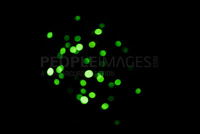 Buy stock photo Green, lights and bokeh in a studio with dark background for celebration, event or party. Confetti, glitter and color sparkles for magic, shine or glow for festive by black backdrop with mockup.