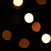 Gold, lights and bokeh on dark blurred background for New Year ...