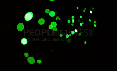 Buy stock photo Green light, bokeh and shine on dark background on a mockup space. Blur, black backdrop and defocused dots, sparkle or glitter glow at night for Christmas, holiday or party with magic color wallpaper